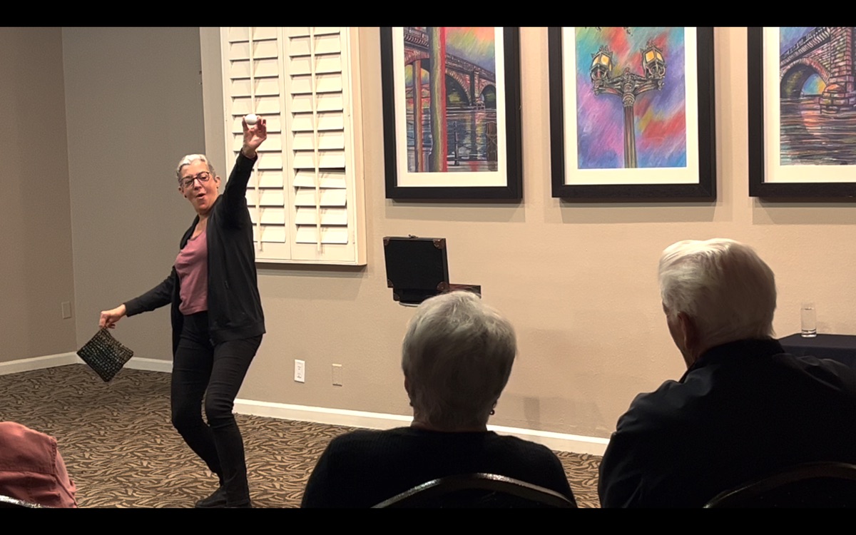 A guest performing an effect for the seated audience