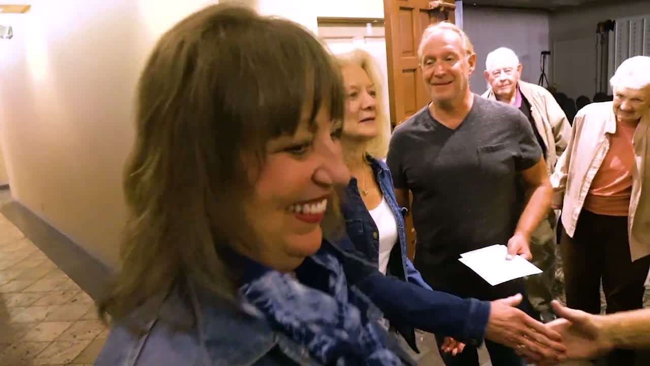 Guests laughing together after Jim Bodine's magic show